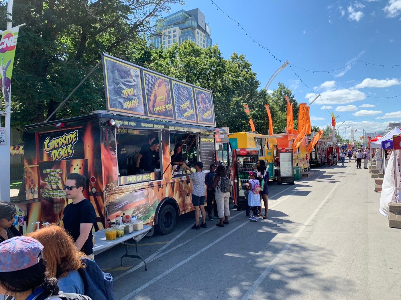 Curbsidedogs truck serving crowds at a street festival