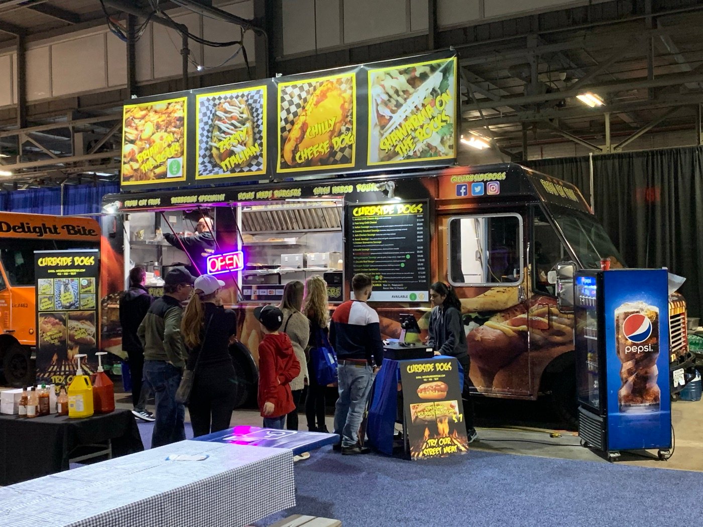 Curbsidedogs booth at an indoor trade show