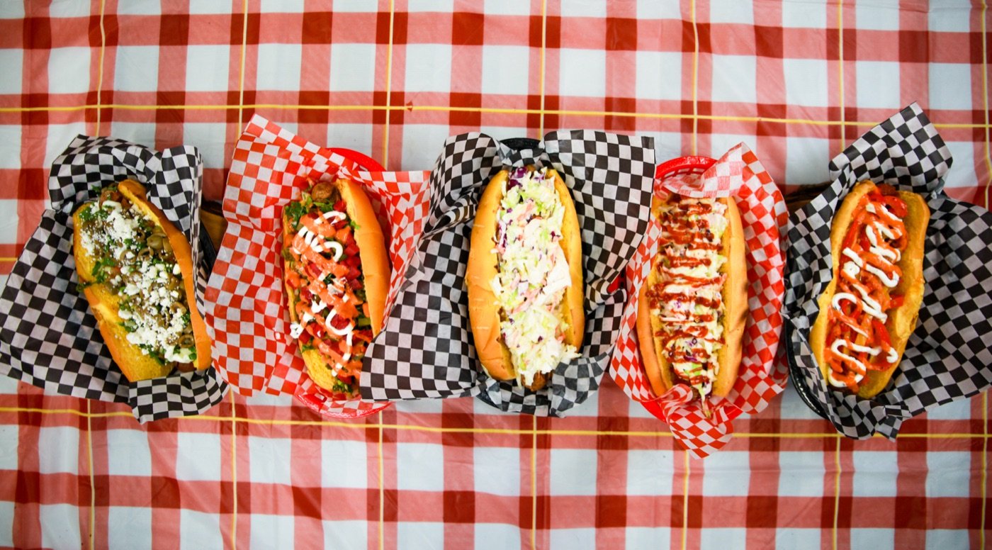 Loaded hot dogs lined up