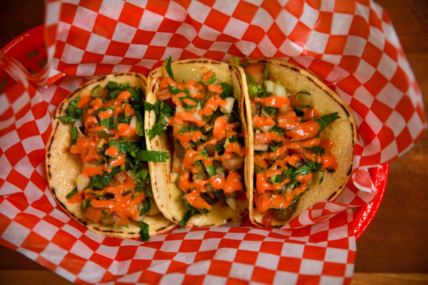 Souvlaki tacos in a checkered basket